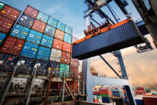 Container,Loading,In,A,Cargo,Freight,Ship,With,Industrial,Crane.